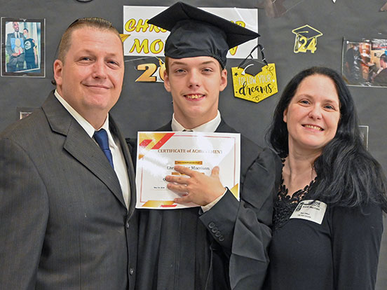  This is a photo of Christopher Morrison Jr. with his parents